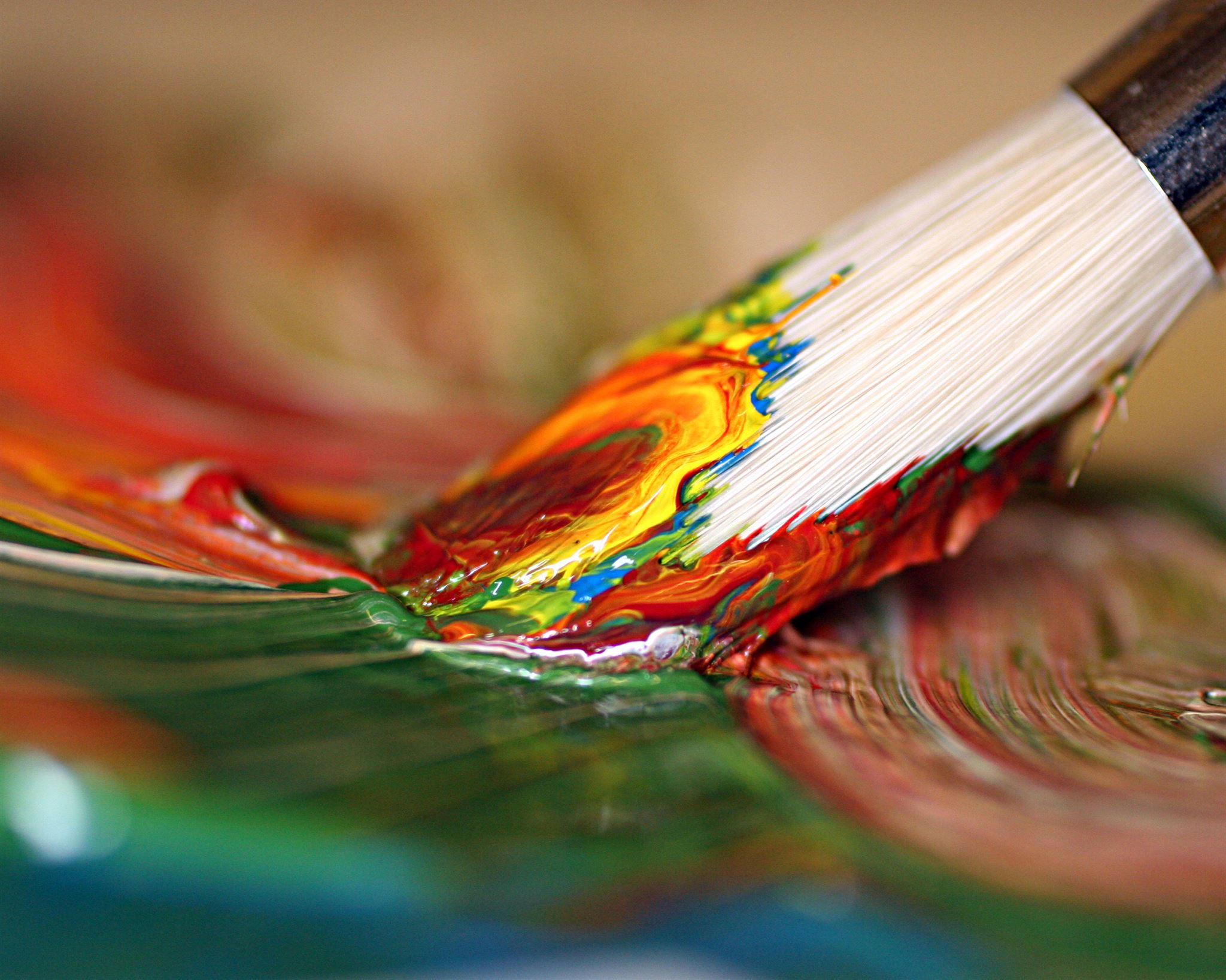 Paintbrush-in-swirled-paint-colors
